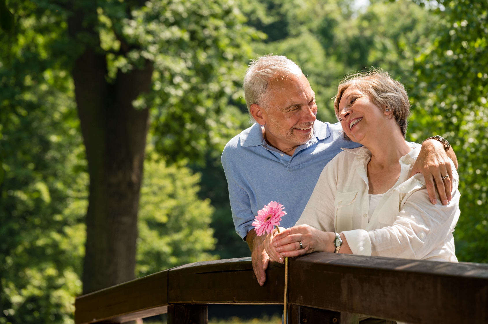 couple standing on bridge